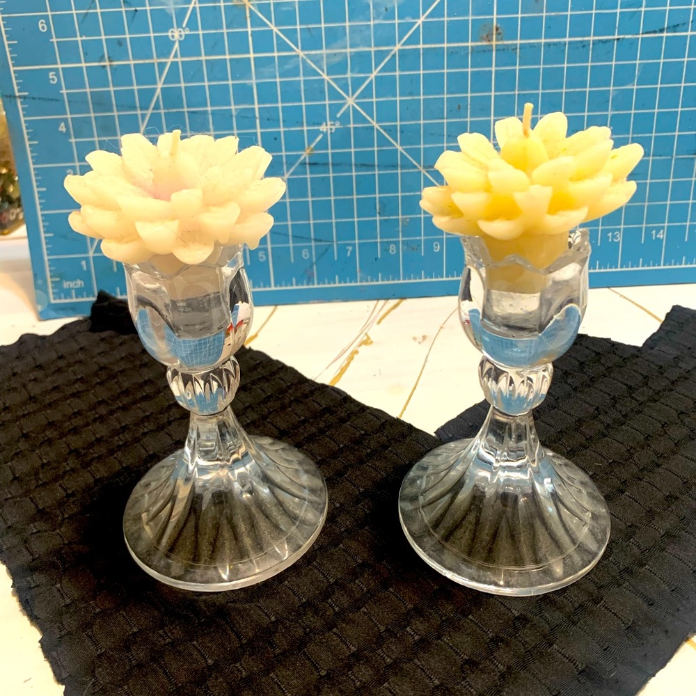 Set of floral candles and holders